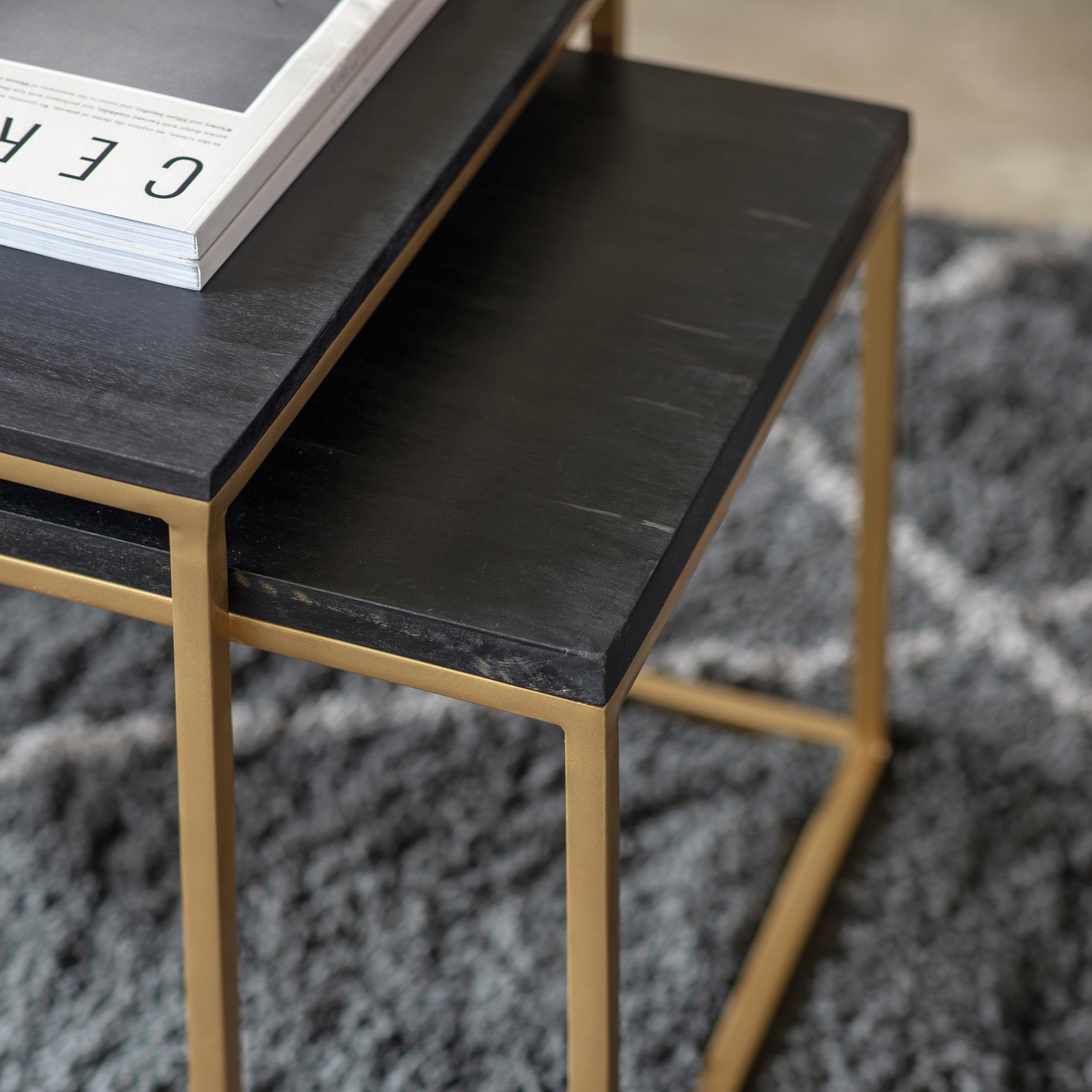 Read more about Nest of 3 coffee tables in black and gold bertie caspian house